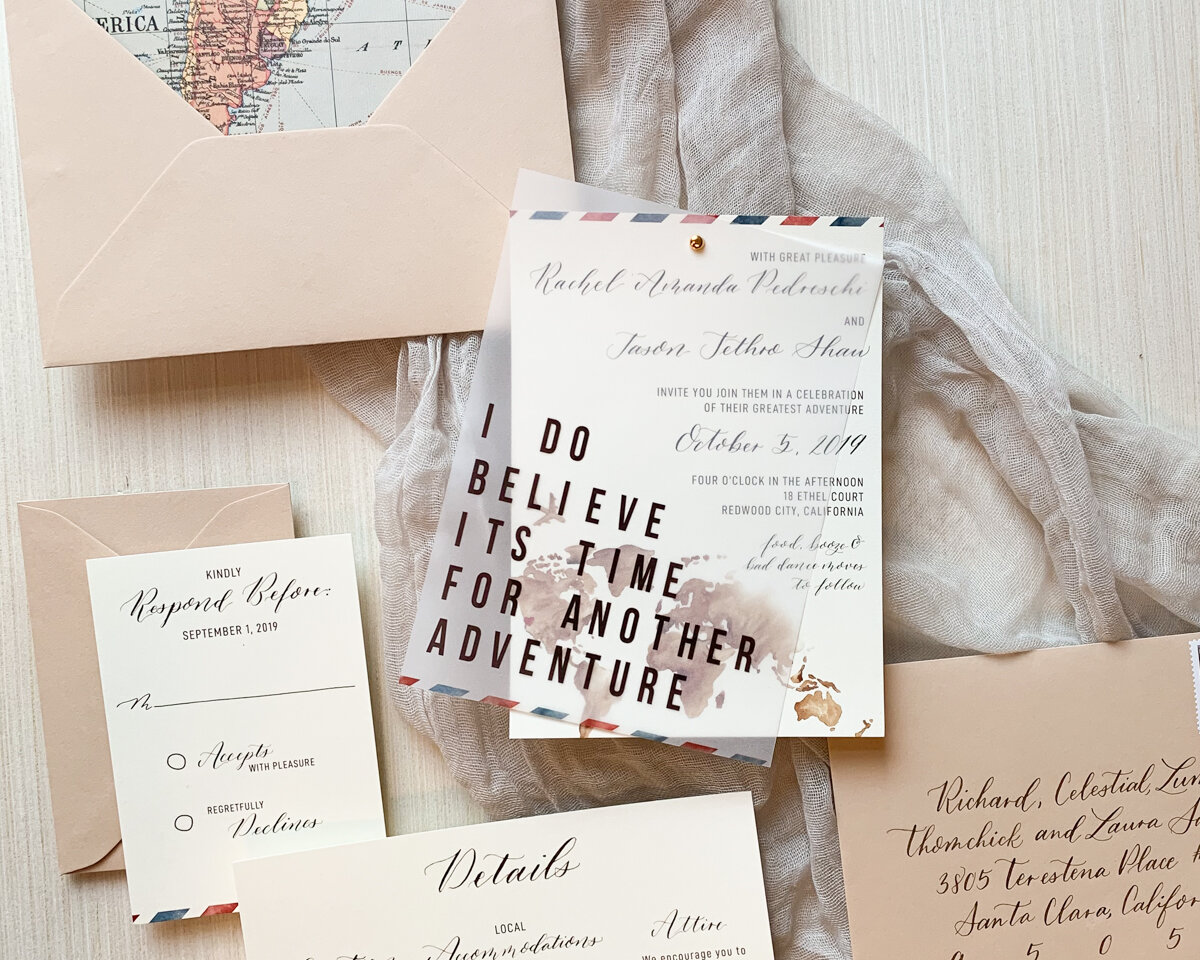 Vellum overlay with text that the couple saw in an airport on an oversized letter board. It was the perfect companion to their travel themed invitation suite.