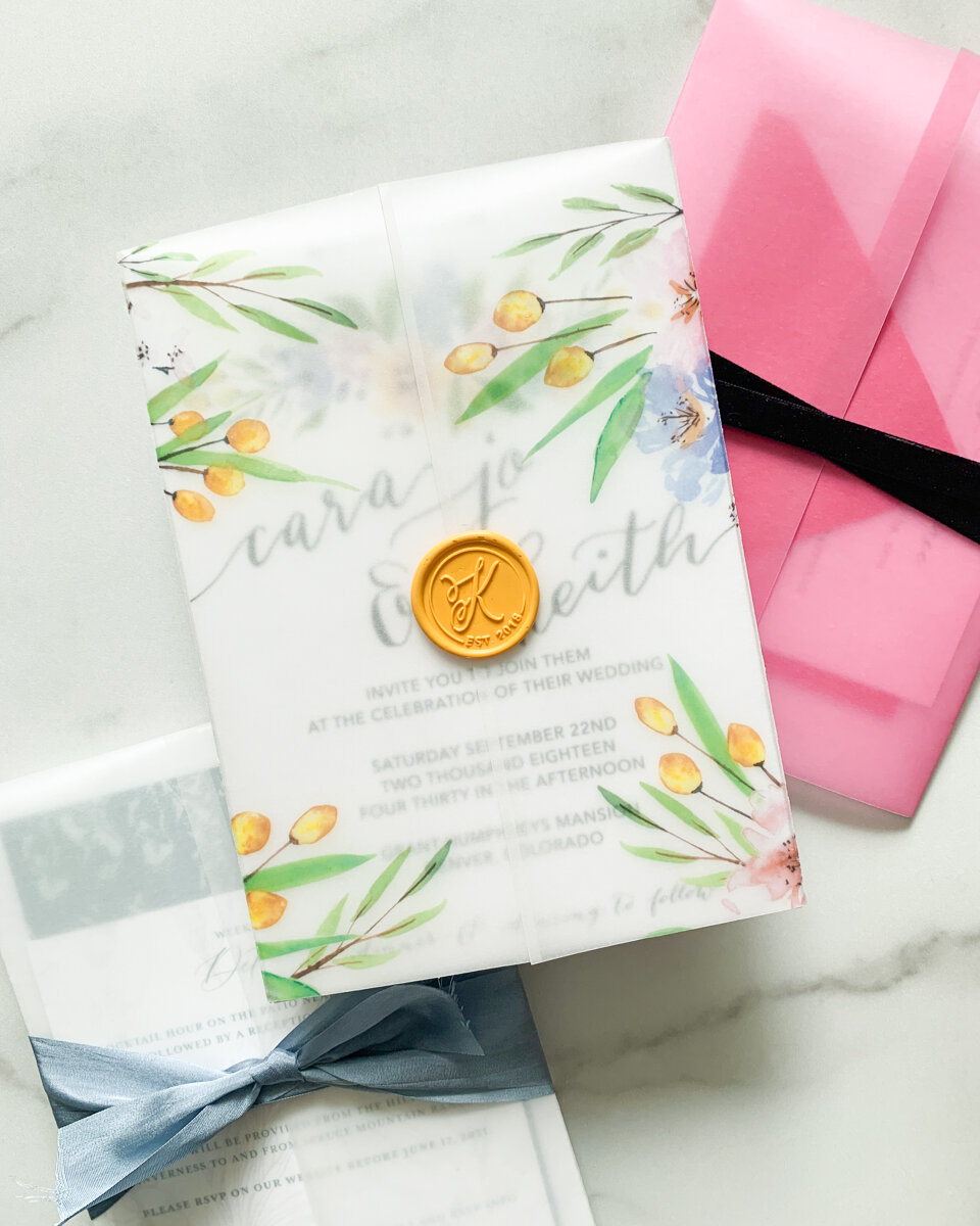 Our own wedding invitations included a vellum wrap with printed watercolor florals and a wax seal