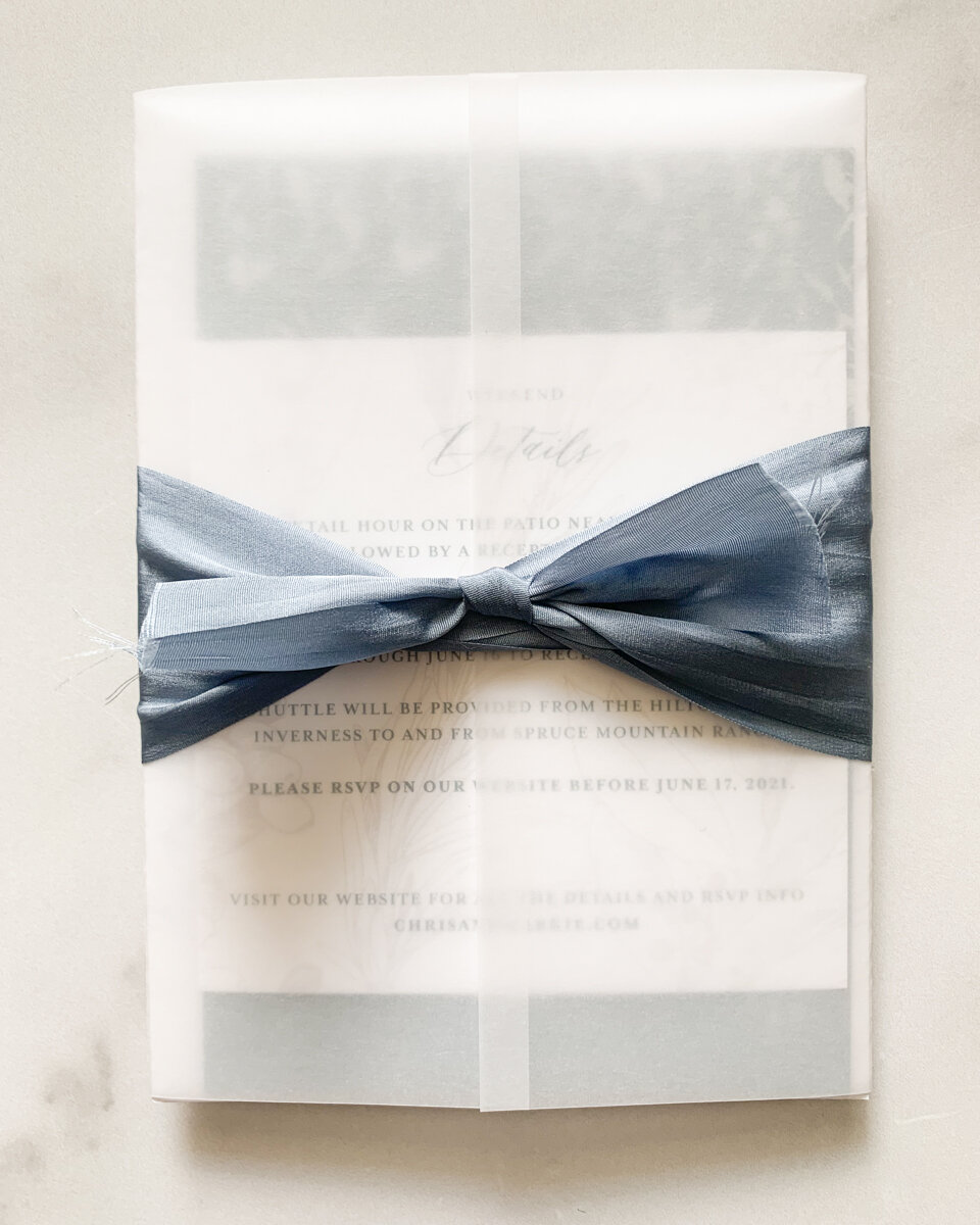 Keep it simple with white translucent vellum and a silk ribbon.