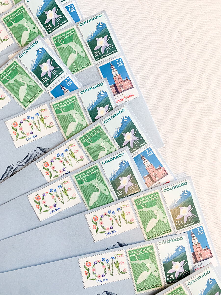 This collection included vintage stamps from states the bride &amp; groom grew up in, the state they are getting married in, and one with wildflowers because she loves flowers!